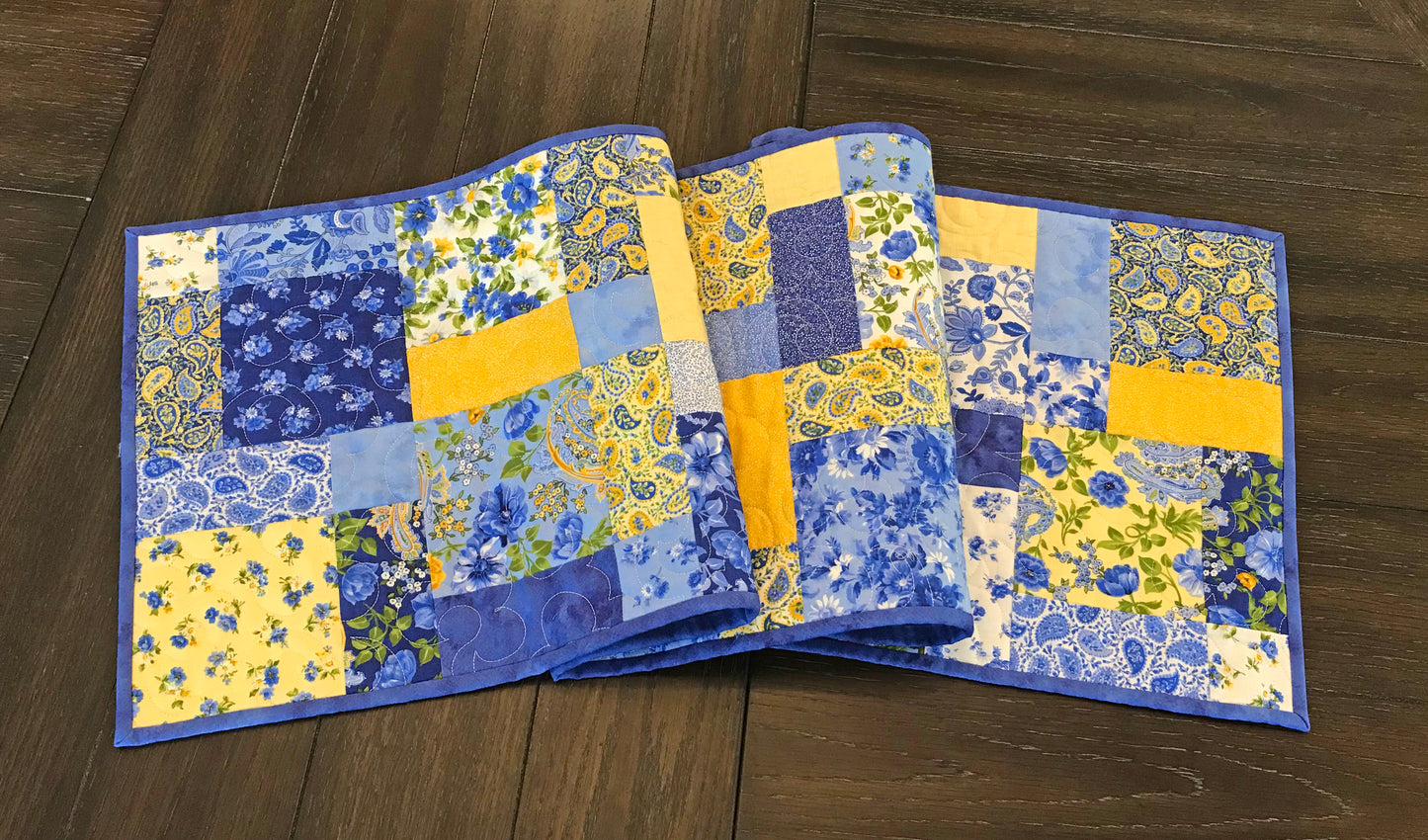 Charmingly Simple patchwork table runner pattern sample runner displayed on a table